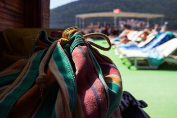 Sunbeds on the ship under the open sky, a lot of plastic beds fo