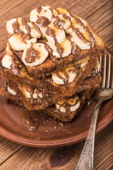 French toasts with banana chocolate sauce and honey.