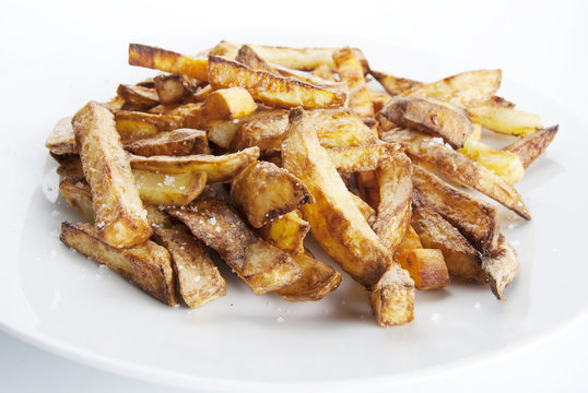 Fried potatoes on a white plate