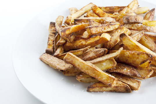 Fried potatoes on a white plate