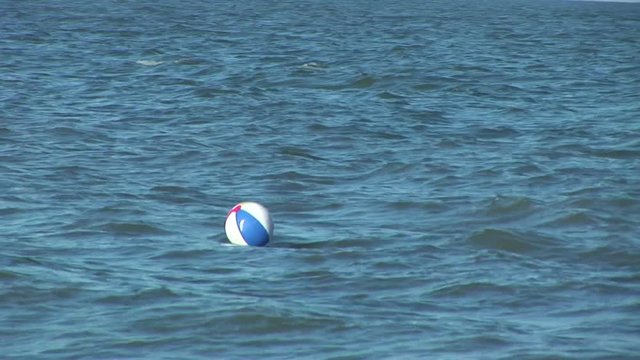 a lost beachball drifts offshore