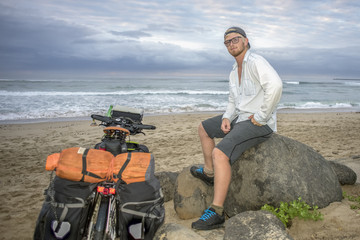 Adventure Cyclist on Beach by Bicycle