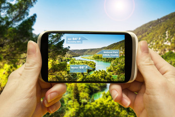 Augmented reality applications for travel and leisure. Hand with