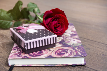 Rose, gift box and book. Valentines Day background