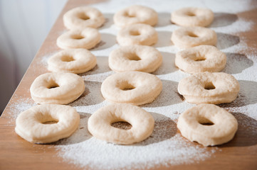 Chef preparing dough - cooking donuts process
