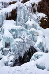 Fototapeta na wymiar Waterfall in wintertime