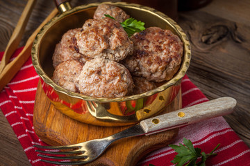 Fried pork chops in the pan.