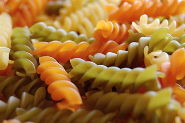 detail of colorful italian fusilli pasta - white, green and orange - 136598797