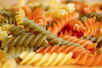 detail of colorful italian fusilli pasta - white, green and orange - 136598798