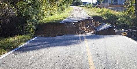 Hurricane Matthew damage showing in a completely washed out two-lane road near Fayetteville North...