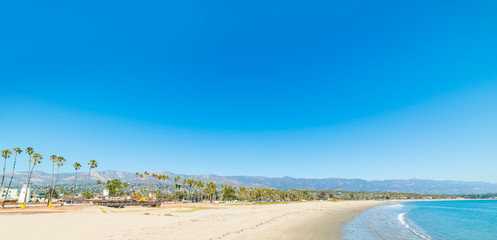 Blue sky over Santa Barbara shoreline - obrazy, fototapety, plakaty