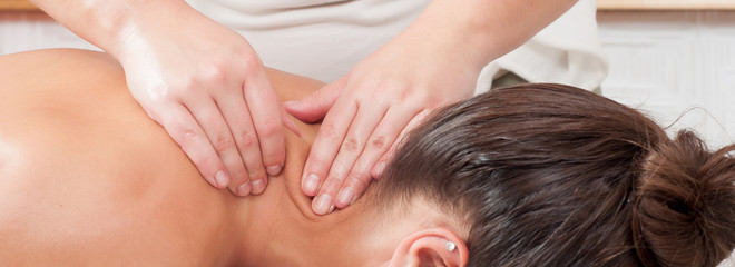 Girl getting professional back massage in health spa