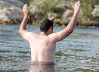 a man floating in the river