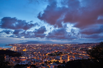 Fototapeta na wymiar Malaga on a cloudy day at sunset