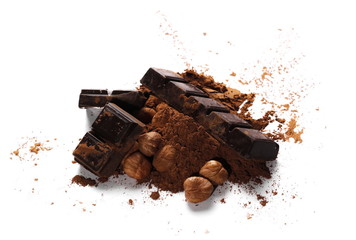 chocolate bars with cocoa powder and pile hazelnuts isolated on white background