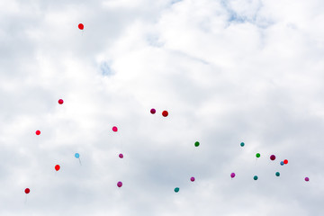 balloons fly into the clouds