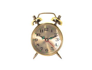 shiny bronze vintage alarm clock isolated on white background