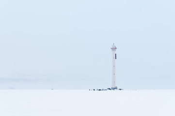 Obraz premium Old lighthouse in winter