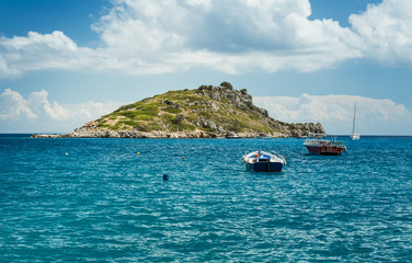 Boats near island in the Mediterranean sea