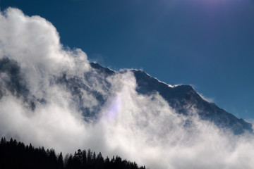 Massif Mont Blanc mountain ridge swept by strong winds partially