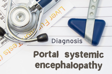 Diagnosis Portal systemic encephalopathy. Neurological hammer, stethoscope and liver laboratory test lie on note with title of Portal systemic encephalopathy Concept for neurology and gastroenterology