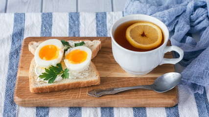 breakfast with boiled eggs and crispy toasts, closeup
