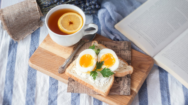 breakfast with boiled eggs and crispy toasts, closeup