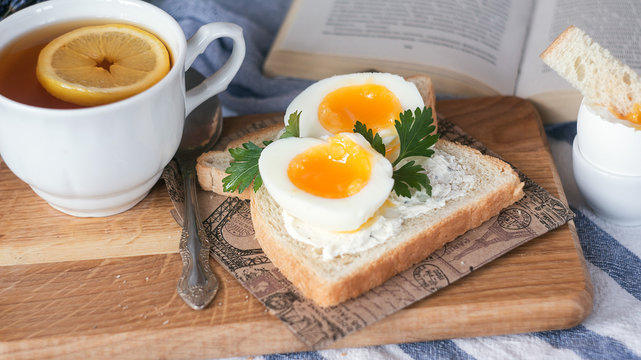 breakfast with boiled eggs and crispy toasts, closeup
