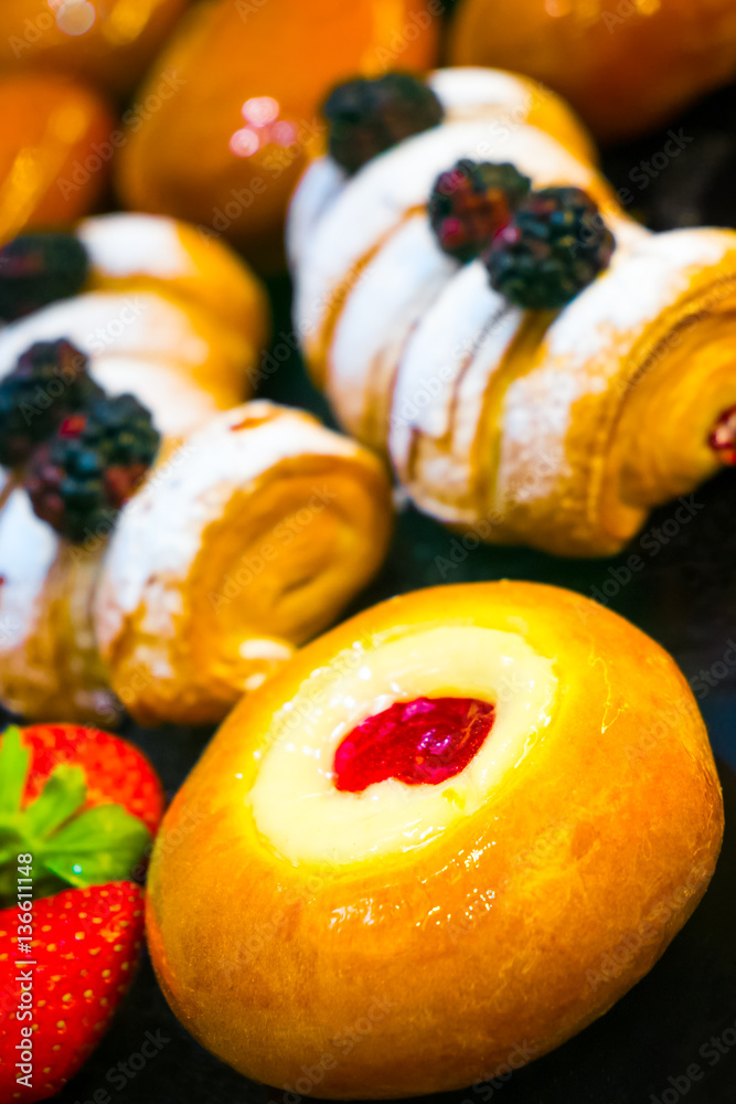 Poster composition of cheesecakes and cakes with berries and icing sugar
