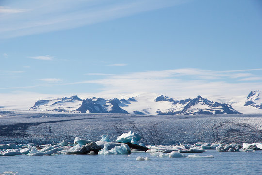 Image showing the Vatnajokull ice cap flowing in to the Jokulsarlon Lagoon with a pleasing range of light blue colours