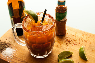 Chilled michelada served on cutting board
