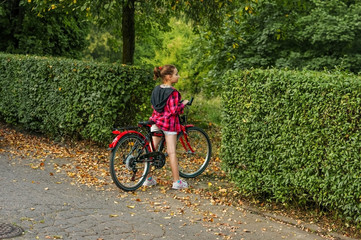 Girl child 10 years old on a Bicycle in the Park.