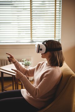 Woman using vr-headset glasses
