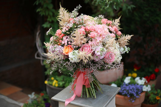 Beautiful designer bouquet of roses hydrangeas Astilbe limoneum matiola