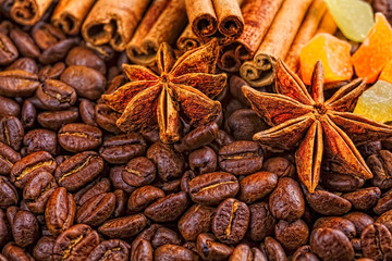 Coffee cup, spices and chocolate on wooden table texture with co