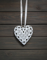 Heart shape ornament on wooden background
