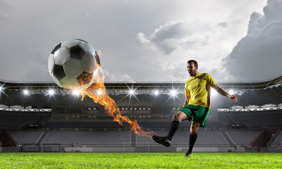 Soccer player at sport arena . Mixed media