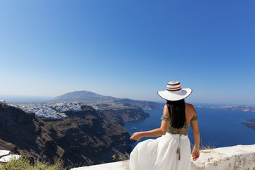 Fototapeta na wymiar Attractive woman in Santorini