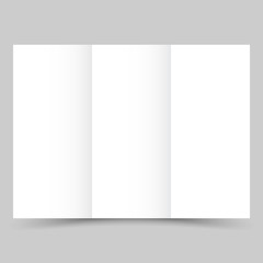 Blank white tri fold paper brochure with shadow.