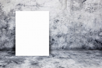 Blank white paper poster lean at bare concrete wall.