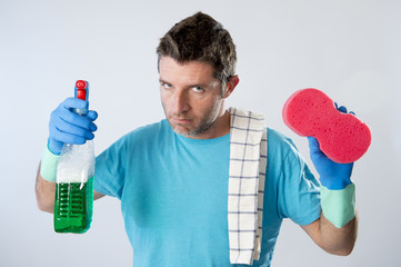 domestic service man or tired husband angry and stressed house cleaning with spray bottle and sponge
