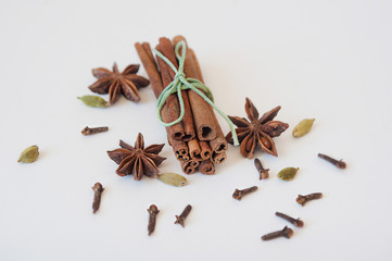 Set of cinnamon, clove and star anise on white background. Close up