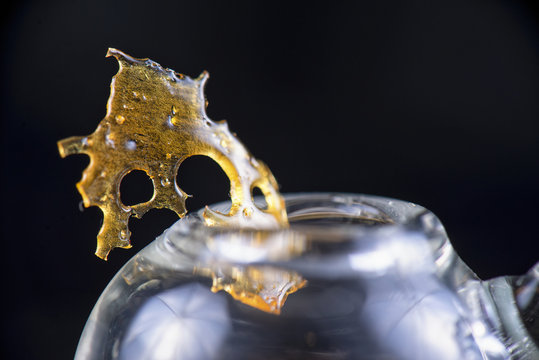 Marijuana oil concentrate aka shatter isolated with glass rig on
