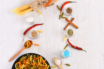 Dried colorful italian pasta with red chilly peppers