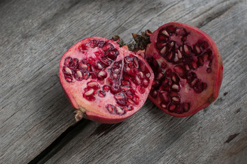 half pomegranet on the wooden table