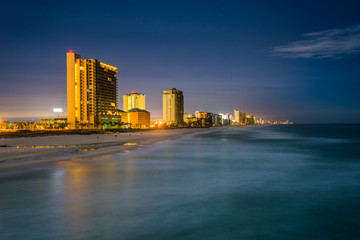 Obraz premium Highrises along the Gulf of Mexico at night, in Panama City Beac