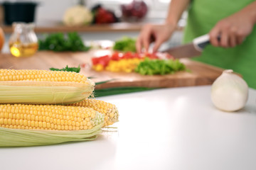 Close up of  woman's hands cooking in the kitchen. Housewife slicing ​​white bread. Vegetarian and healthily cooking concept