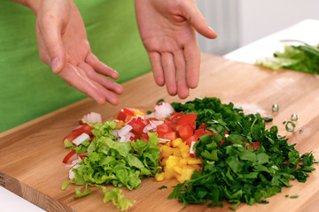 Close up of  woman's hands cooking in the kitchen. Housewife slicing ​​white bread. Vegetarian and healthily cooking concept