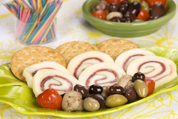 prosciutto cheese dish with olives