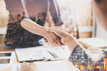 Double exposure of handshake,Close-up of businesswoman handshaki